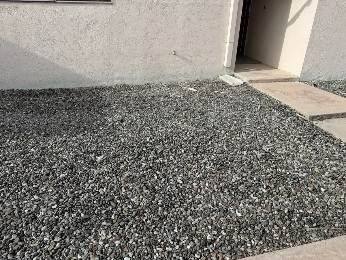 Rental property exterior landscape and gravel