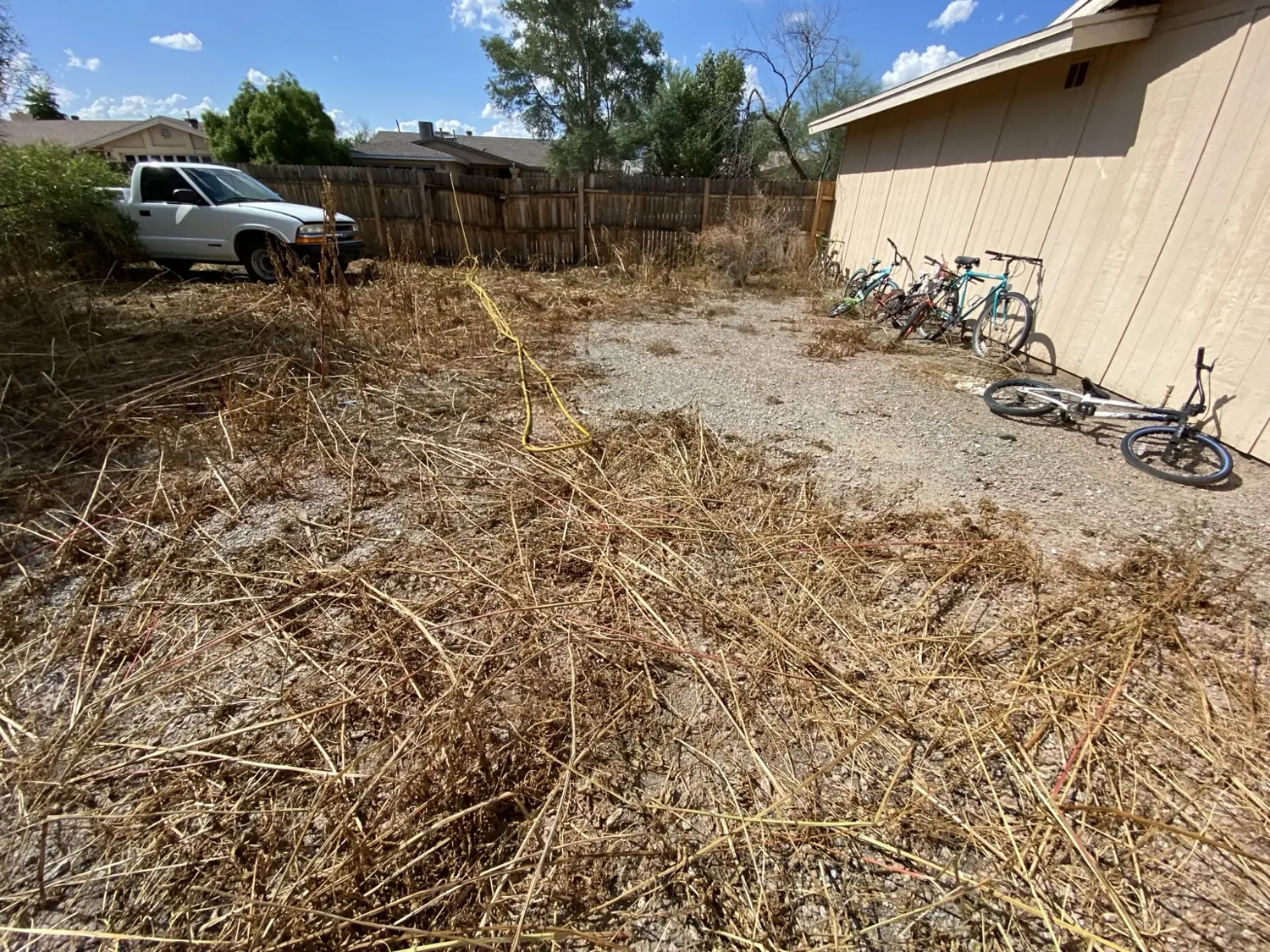 Additional after-treatment view beside the building and fence